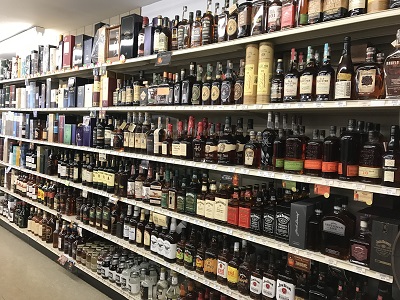 photo of spirit bottles on a shelf at Basin Wine liquor store